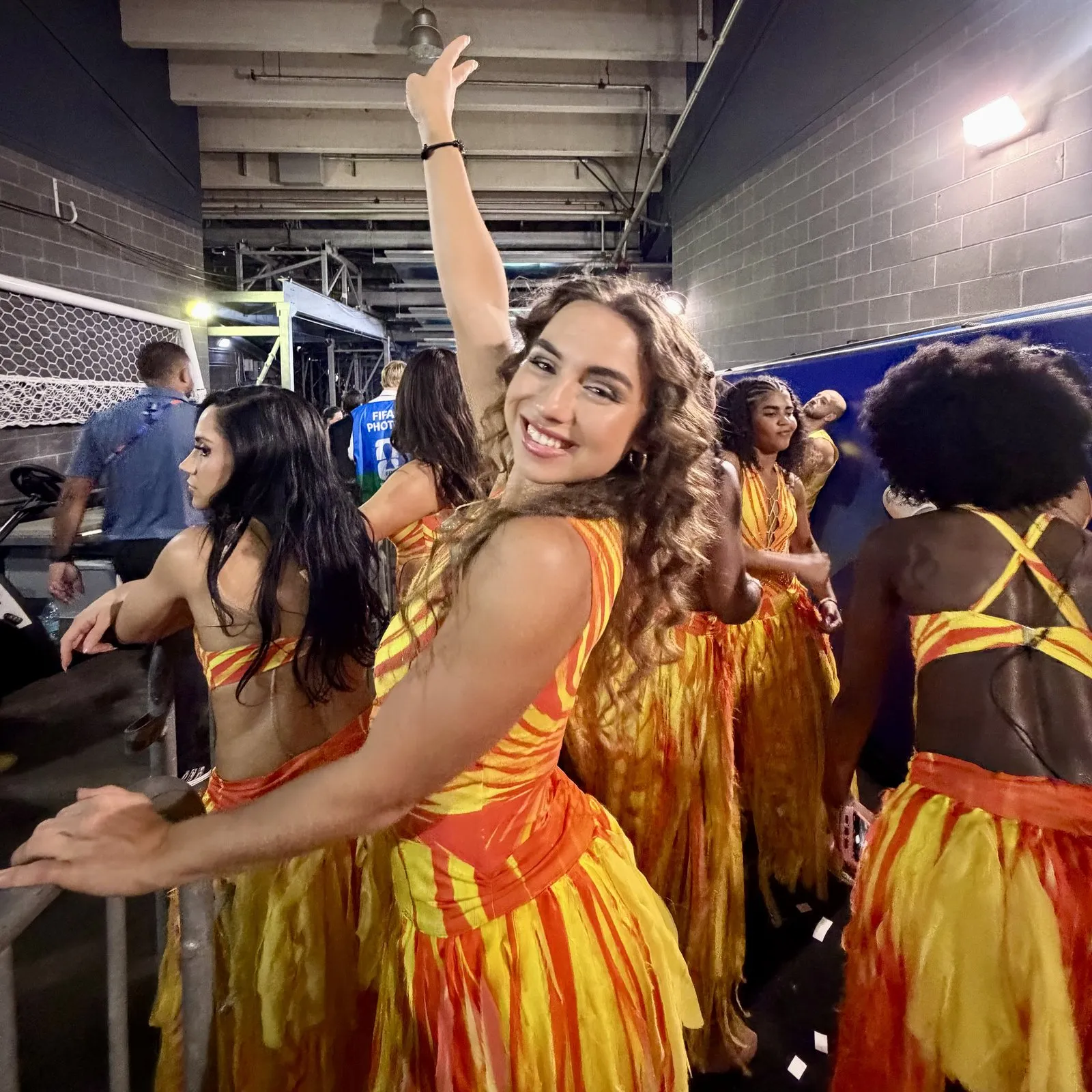 Enola Bedard backstage with fellow dancers before the halftime performance.