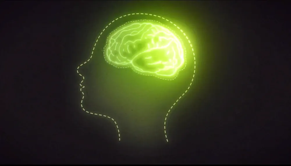 A glowing brain illuminated inside the outline of a human head, representing how buyer perception forms.